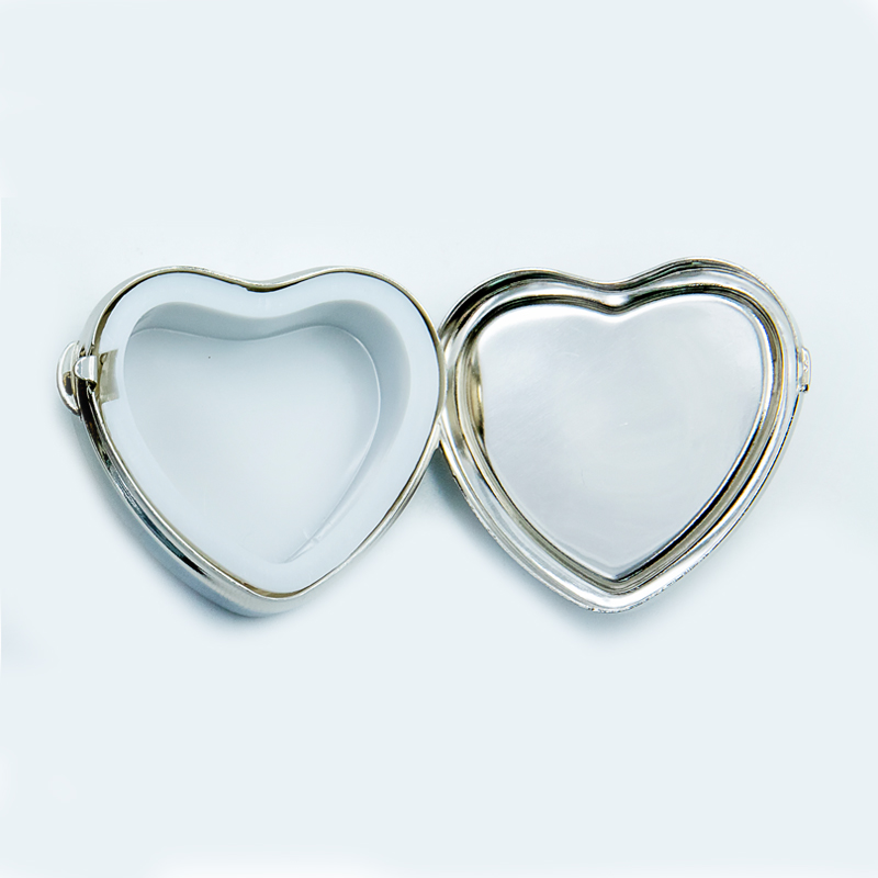 small heart-shaped enamel pill box